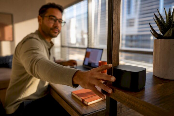 Remote worker checking WiFi in furnished rental